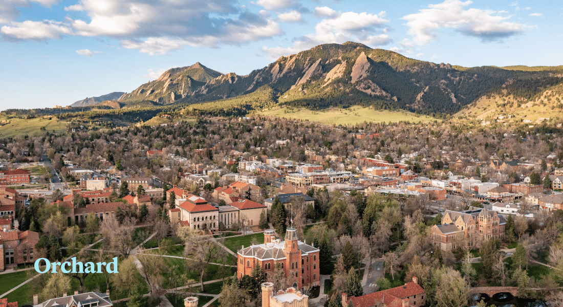 Scenic aerial view of a Boulder, Colorado neighborhood with the Flatirons in the background.